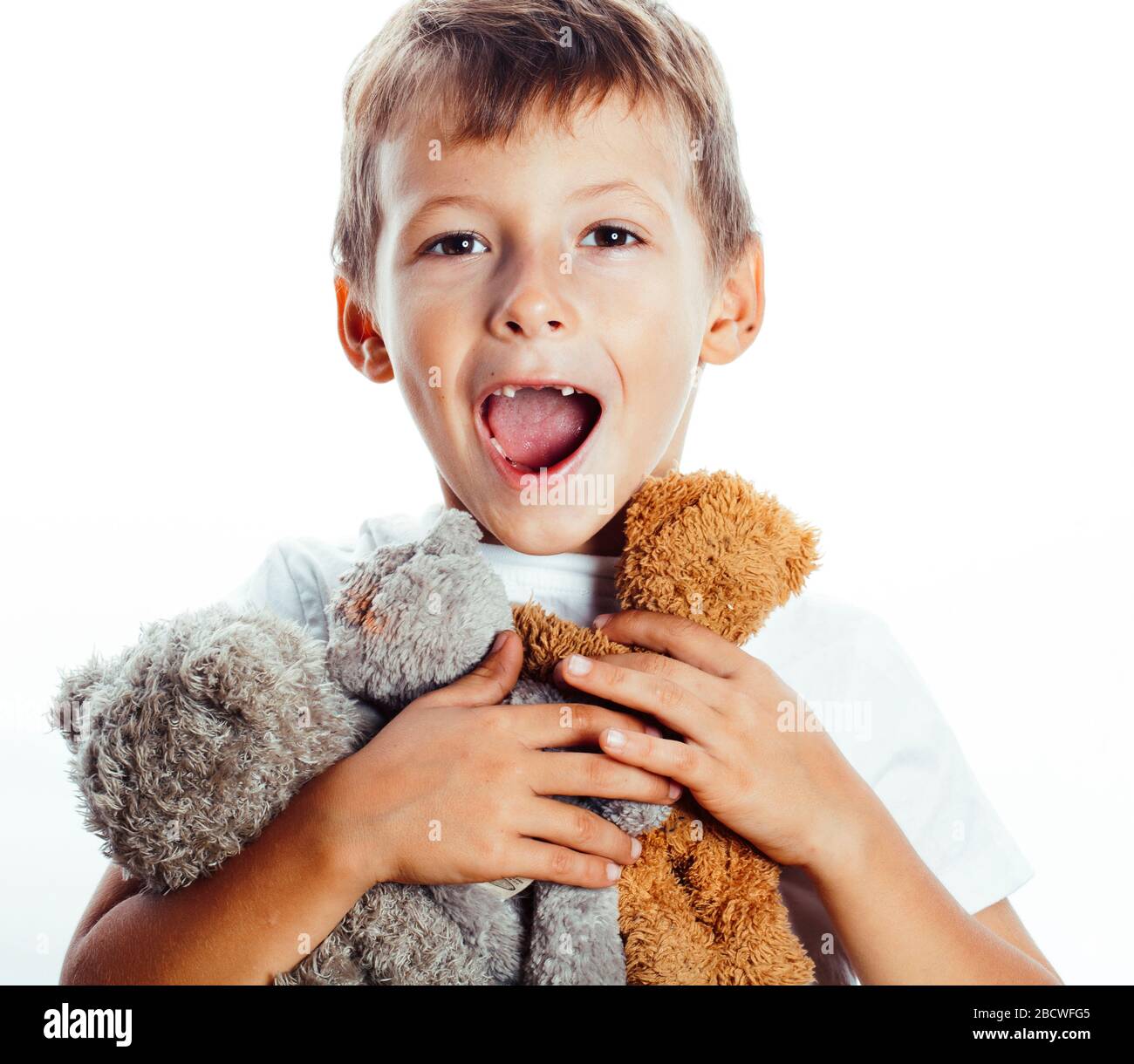 little cute boy with many teddy bears hugging isolated on white ...