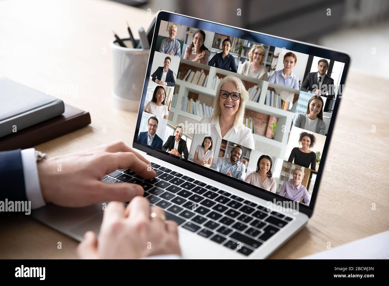 Diverse people engaged in group video call, computer monitor view Stock Photo