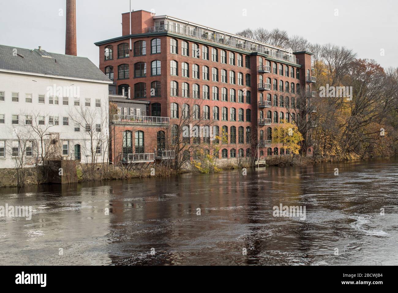 Old Mills and buildings , Blackstone River, Pawtucket, RI. Just behind Police Station on the Blackstone River Canal Historical Trail or region. Stock Photo