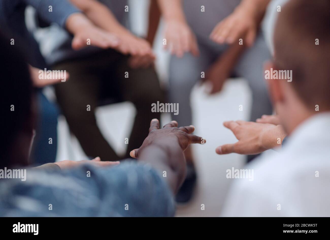 close up. diverse young people joining their palms Stock Photo