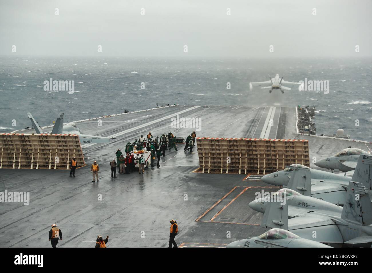 U.S. Navy F/A-18E and F/A-18F Super Hornet fighter aircraft stack up as they prepare for rapid launch on the flight deck of the Ford-class aircraft carrier USS Gerald R. Ford underway conducting its flight deck and combat air traffic control center certification March 21, 2020 in the Atlantic Ocean. Stock Photo