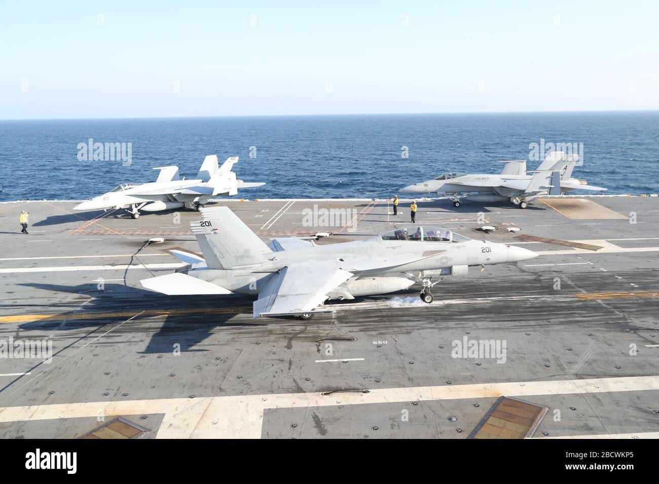 A U.S. Navy F/A-18E Hornet fighter aircraft attached to the Blacklions of Strike Fighter Squadron 213, lands on the flight deck of the Ford-class aircraft carrier USS Gerald R. Ford underway conducting its flight deck and combat air traffic control center certification March 19, 2020 in the Atlantic Ocean. Stock Photo
