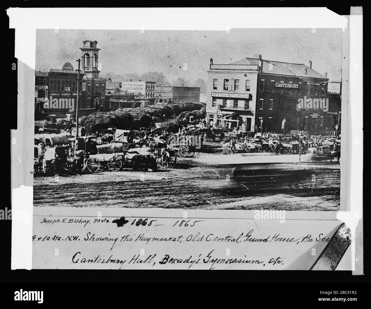 'English: Title: 9 & 10 Sts., N.W., showing the Haymarket, Old Central Guard House, the sec [...], Canterbury Hall, Brady's Gymnasium, etc., [Washington, D.C.] Abstract/medium: 1 negative : glass ; 8 x 6 in.; between 1921 and 1922 date QS:P,+1921-00-00T00:00:00Z/8,P1319,+1921-00-00T00:00:00Z/9,P1326,+1922-00-00T00:00:00Z/9; Library of Congress  Catalog: http://lccn.loc.gov/2016824057 Image download: http://cdn.loc.gov/service/pnp/npcc/30300/30381v.jpg Original url: https://www.loc.gov/pictures/item/2016824057/; National Photo Company Collection; ' Stock Photo