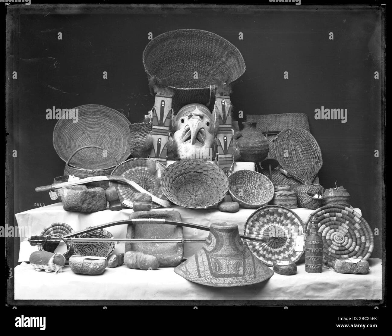 Zuni Artifacts. Baskets, bow, stone tools and containers.Smithsonian Institution Archives, Acc. 11-007, Box 015, Image No. MNH-3549Smithsonian Institution Archives Capital Gallery, Suite 3000, MRC 507; 600 Maryland Avenue, SW; Washington, DC 20024-2520 MNH-3549 Stock Photo