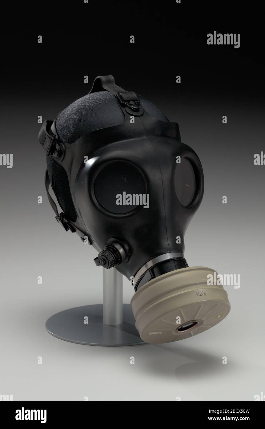 Gas mask with filter canister worn at demonstrations in Ferguson Missouri. A Shalon Chemical Industries Ltd., adult model 4A1, Nuclear, Biological, and Chemical (NBC), black, rubber gas mask (2016.122a), with a Type 80, NBC filter canister (2016.122b) worn by Dr. Gas mask with filter canister worn at demonstrations in Ferguson Missouri Stock Photo