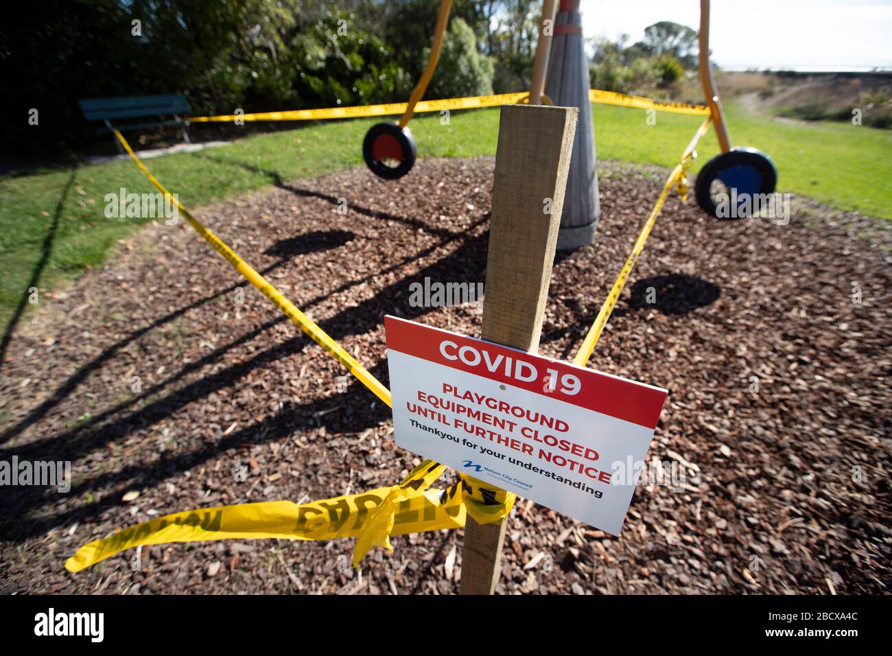 Signs at closed playground due to Covid 19 virus lockdown, Nelson, New Zealand Stock Photo