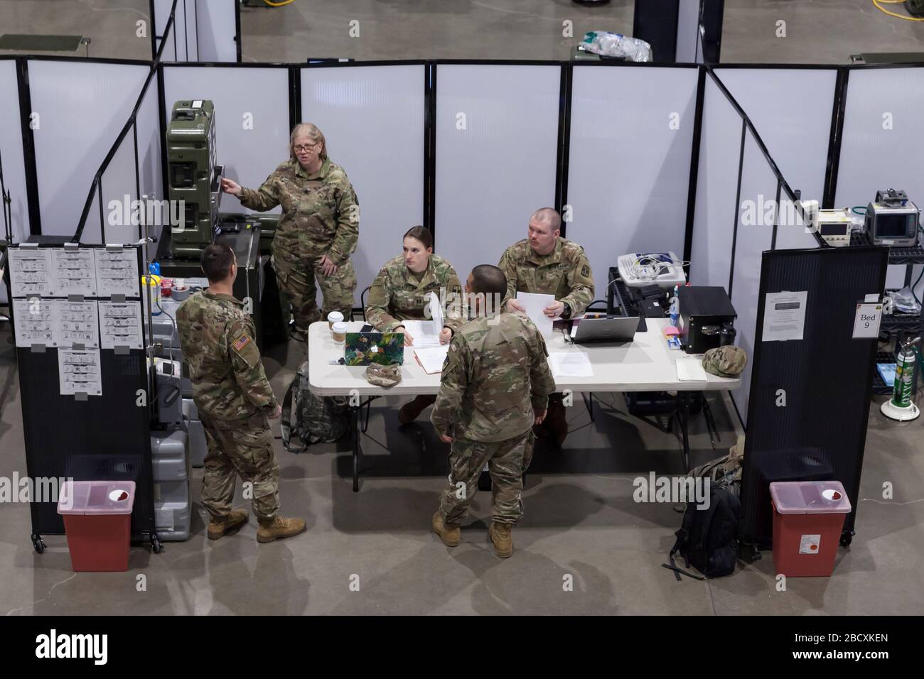 Soldiers are briefed at the field hospital in CenturyLink Field Event Center in Seattle on April 5, 2020. The mobile army surgical hospital, currently for non-COVID-19 cases, involves military medical personnel from multiple units, including the Soldiers from the 627th Hospital Center's 10th Field Hospital at Fort Carson, Colorado, the 62nd Medical Brigade from Joint Base Lewis-McChord, Washington and others. Officials said that he hospital is now ready to accept patients. Stock Photo