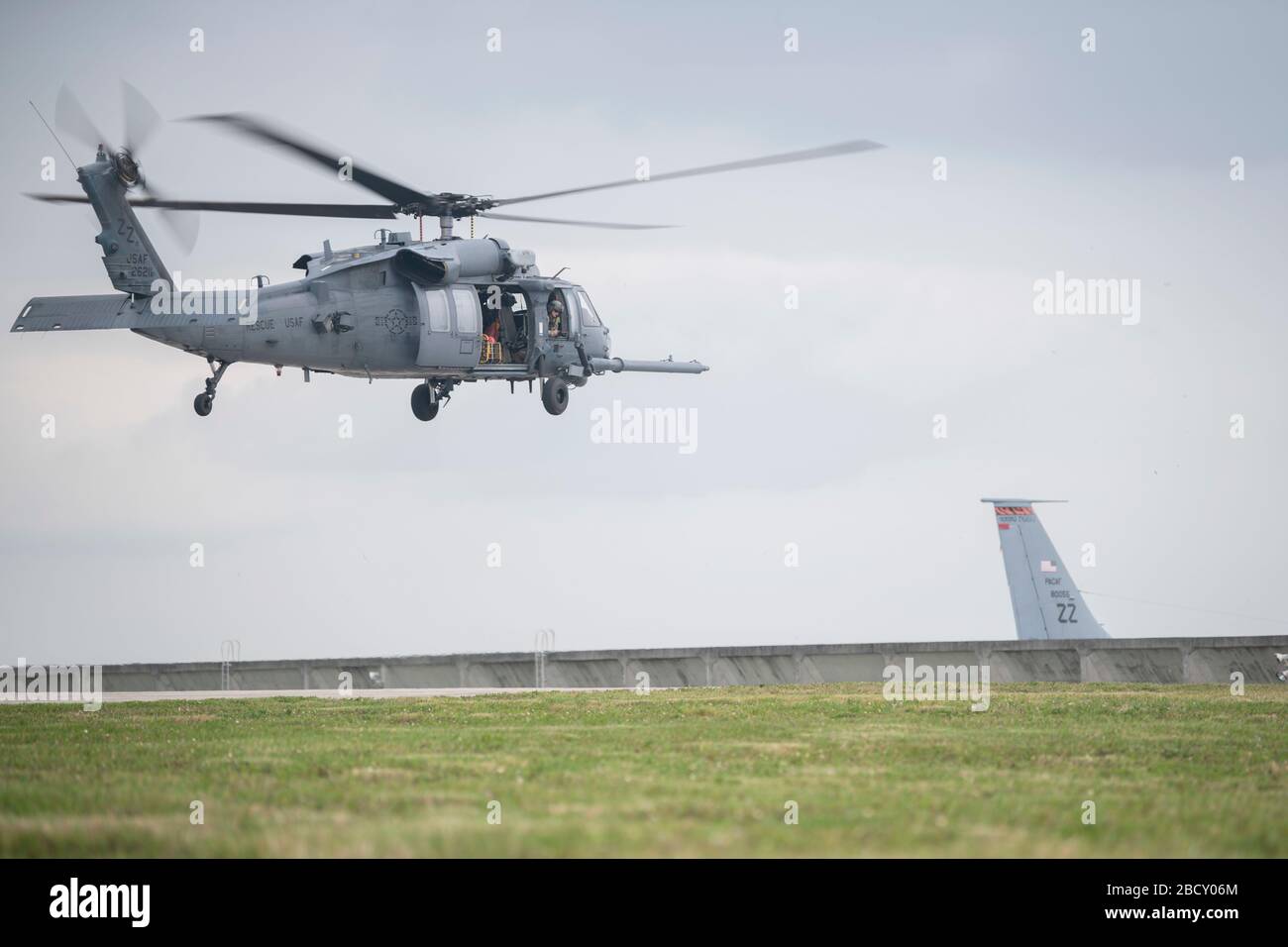 A U.S. Air Force HH-60 Pave Hawk, assigned to the 33rd Rescue Squadron, lifts off for a regular training mission April 3, 2020, at Kadena Air Base, Japan. The HH-60G Pave Hawk, or Precision Avionics Vectoring Equipment, has a hoist that can lift up to 600 pounds during personnel recovery operations. (U.S. Air Force photo by Senior Airman Rhett Isbell) Stock Photo