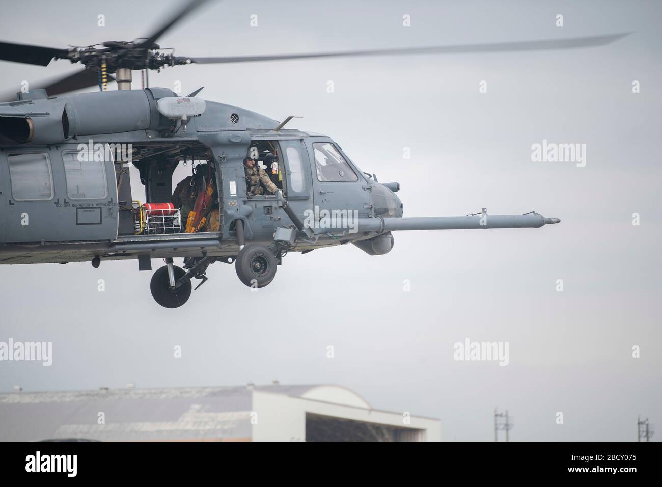 A U.S. Air Force HH-60 Pave Hawk, assigned to the 33rd Rescue Squadron, lifts off for a regular training mission April 3, 2020, at Kadena Air Base, Japan. The HH-60 Pave Hawk’s primary function is to recover personnel in hostile conditions day and night, no matter the weather. (U.S. Air Force photo by Senior Airman Rhett Isbell) Stock Photo