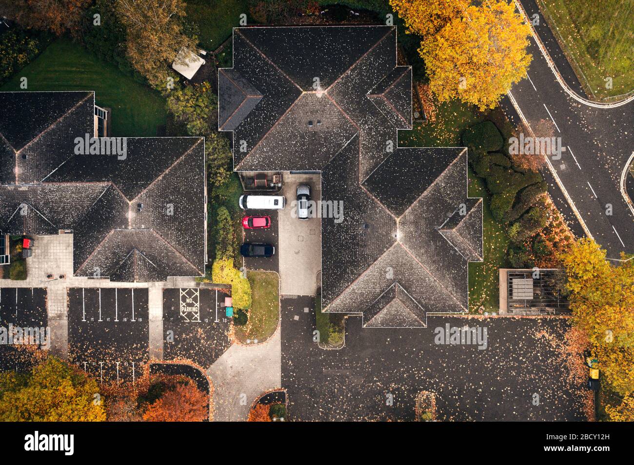 House roof tops at hazy autumnal morning in United Kingdom - top down drone point of view Stock Photo