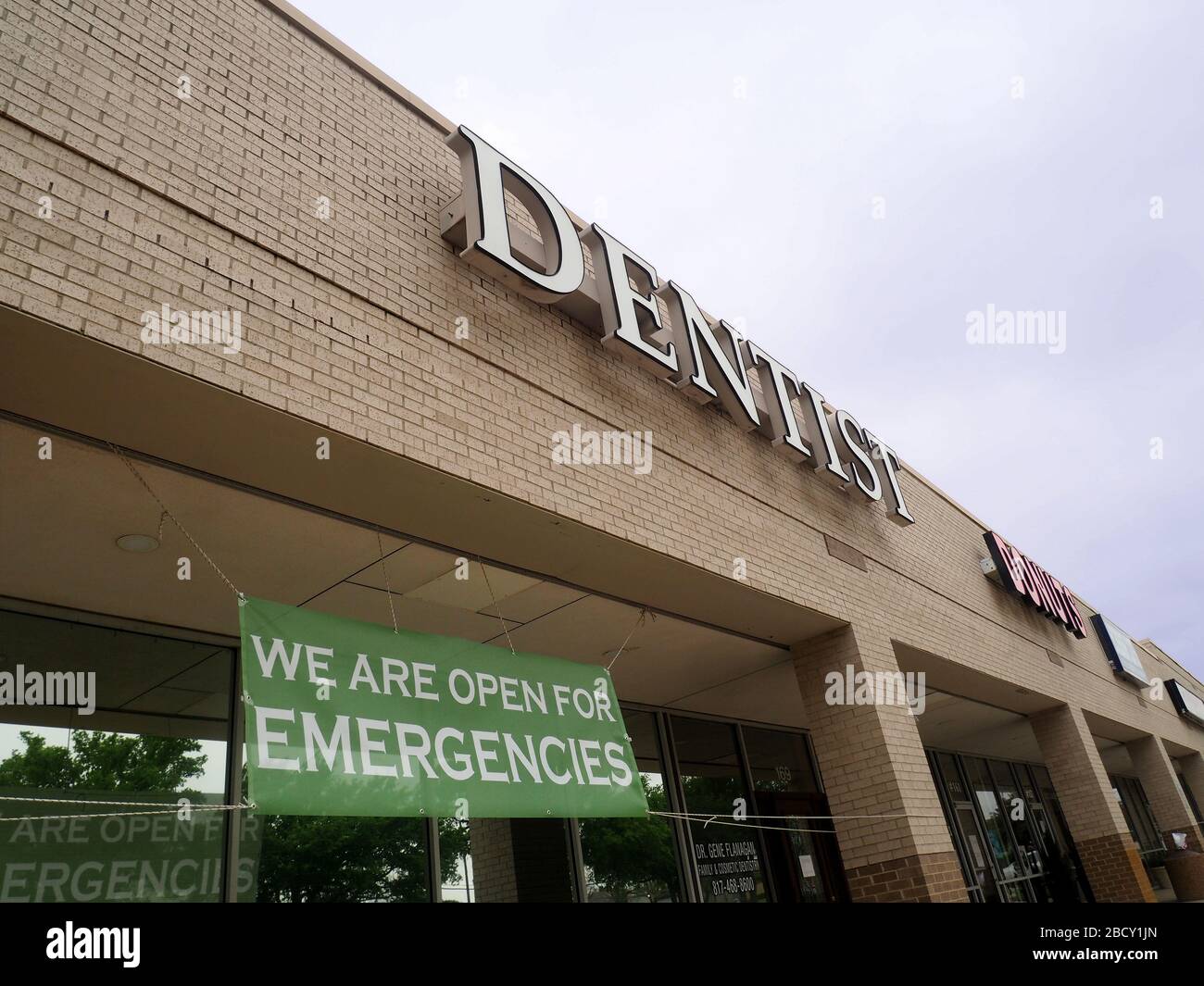 Protection from the Corona virus, at the grocery store people are asked to stay six feet apart and the dentist will only see people if it is an emergency. Stock Photo