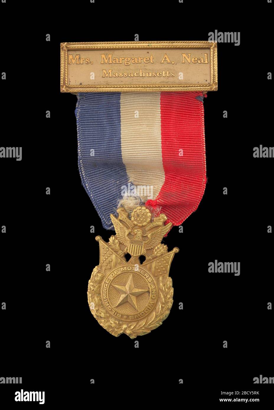 World War I Gold Star Mothers Pilgrimage Medal issued to Mrs Margaret A Neal. 2019.16a: A World War I Gold Star Mothers Pilgrimage medal issued to Mrs. Margaret A. Neal of Massachusetts, in commemoration of her pilgrimage to her stepson's, Second Lieutenant Ralph T. Neal's, gravesite at the Meuse-Argonne American Cemetery and Memorial in France. World War I Gold Star Mothers Pilgrimage Medal issued to Mrs Margaret A Neal Stock Photo
