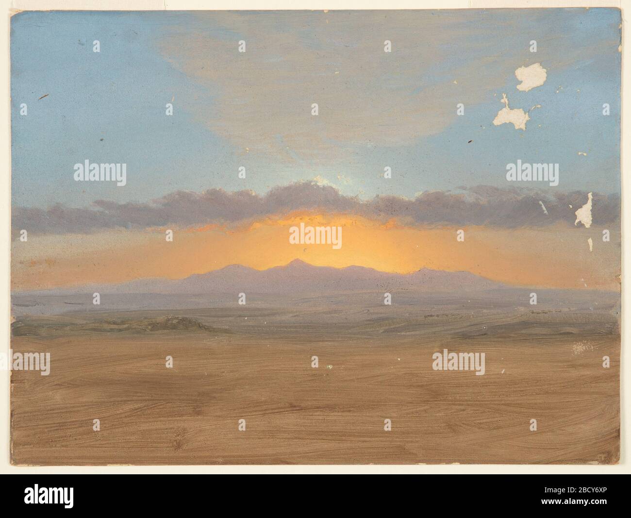 Sunset. Research in ProgressView of mountains across a plain. probably Jamaica, West Indies. Sunset Stock Photo