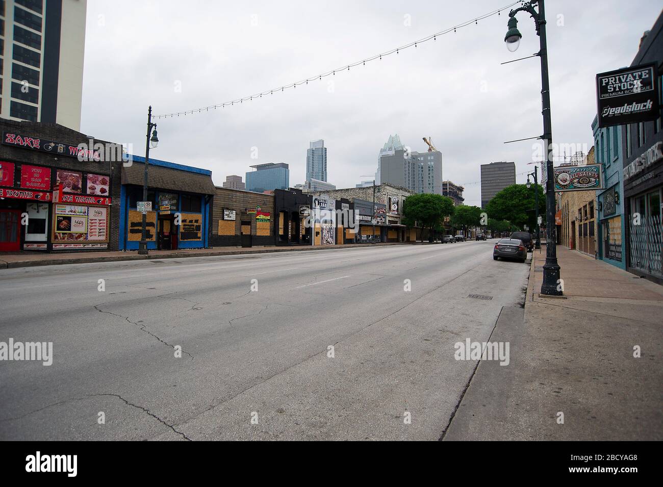 April 05, 2020: Downtown Sixth Street is boarded up due to Covid-19. A vibrant location for tourists and locals to bar hop for live music, it's a ghost town. Austin, Texas. Mario Cantu/CSM. Stock Photo