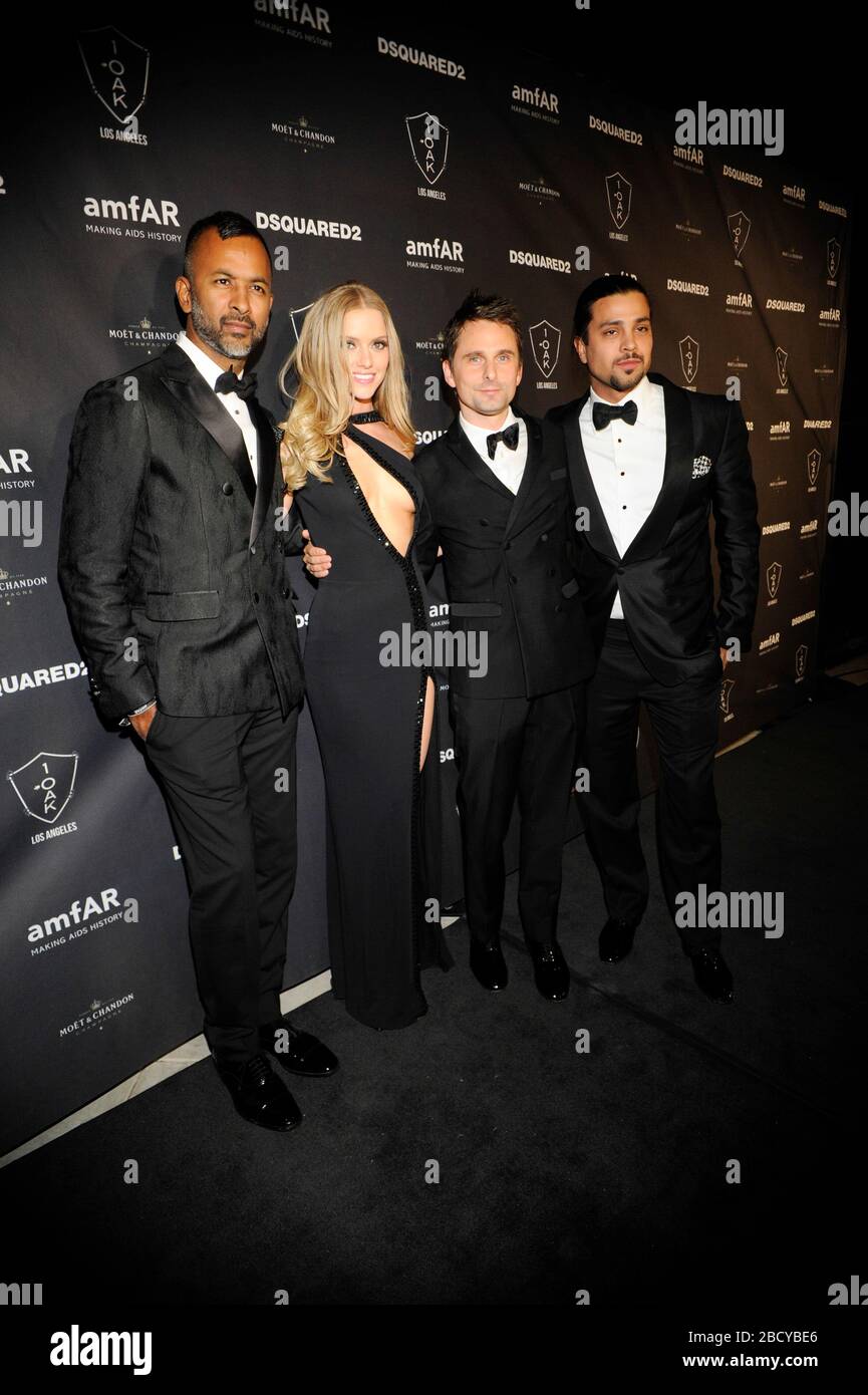 (L-R) Ronnie Madra, Model Elle Evans, Matthew Bellamy of Muse and guest attend amfAR Official After Party at 1OAK on October 29, 2015 in West Hollywood, California. Stock Photo