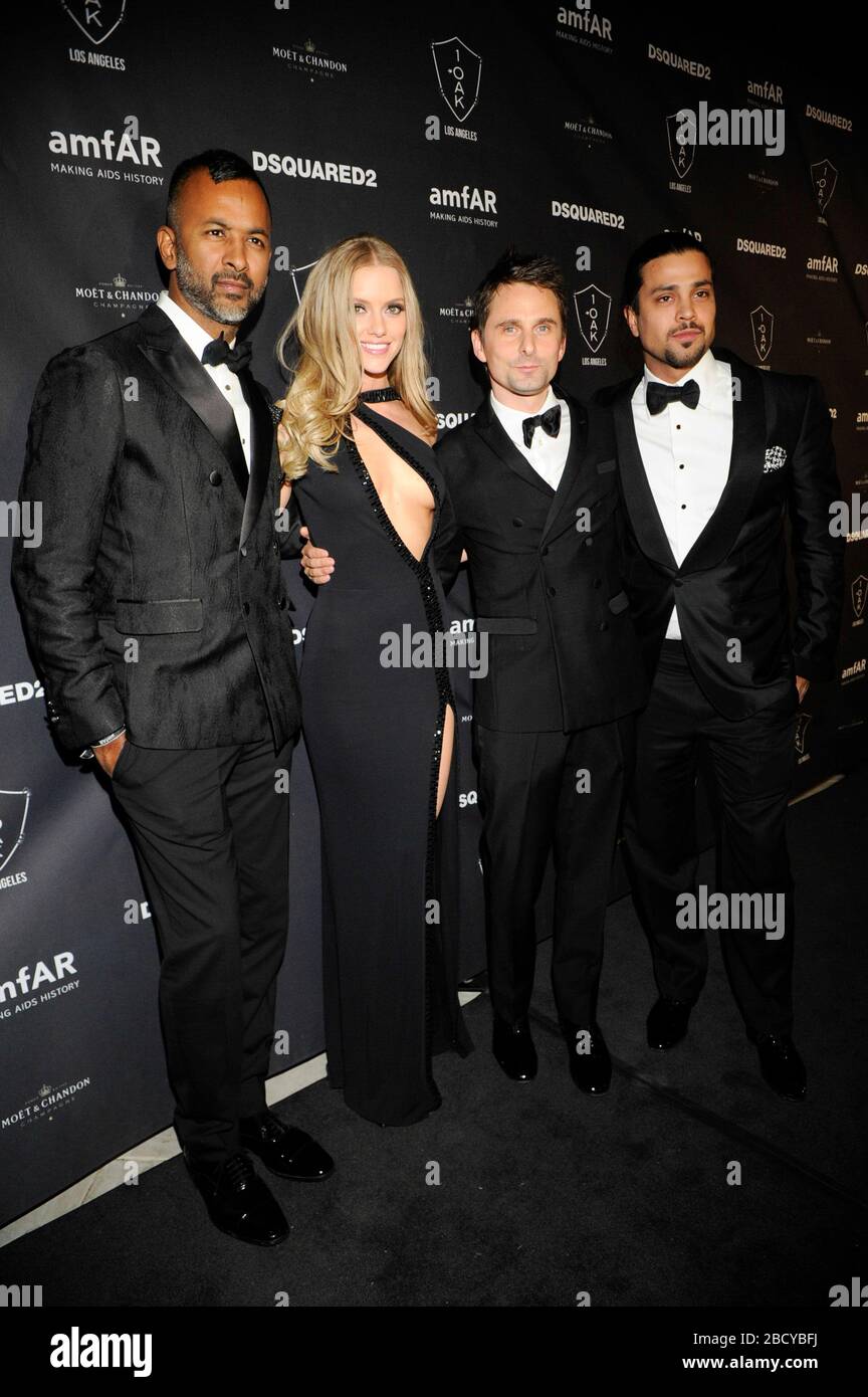 (L-R) Ronnie Madra, Model Elle Evans, Matthew Bellamy of Muse and guest attend amfAR Official After Party at 1OAK on October 29, 2015 in West Hollywood, California. Stock Photo