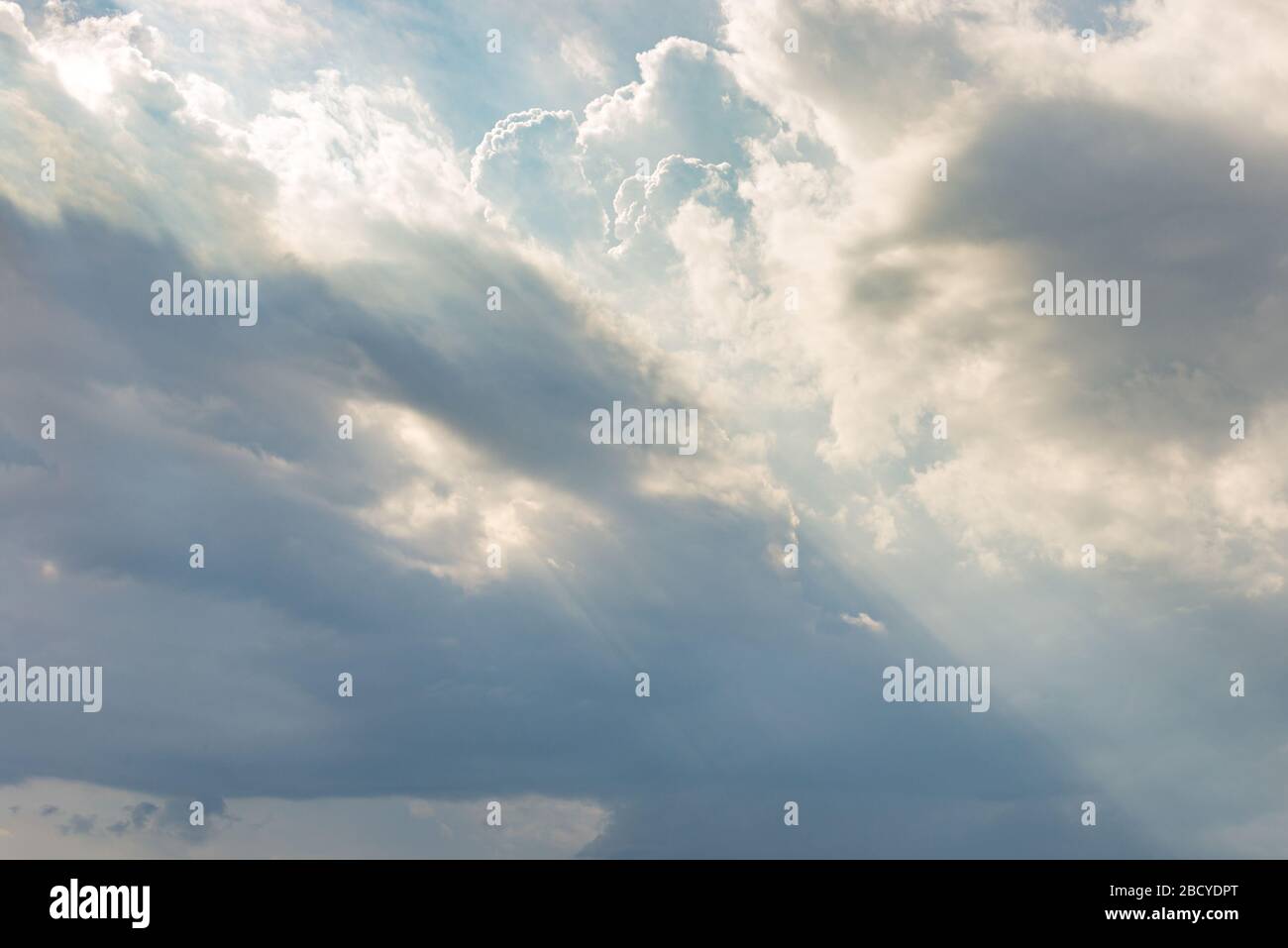Overcast sky with many clouds and little sunbeam for backgrounds Stock Photo