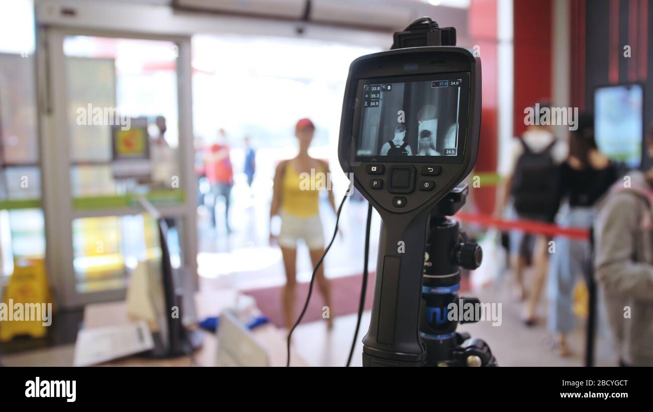 Temperature Check Commercial Temperature check at a supermarket, grocery store with a thermal ...
