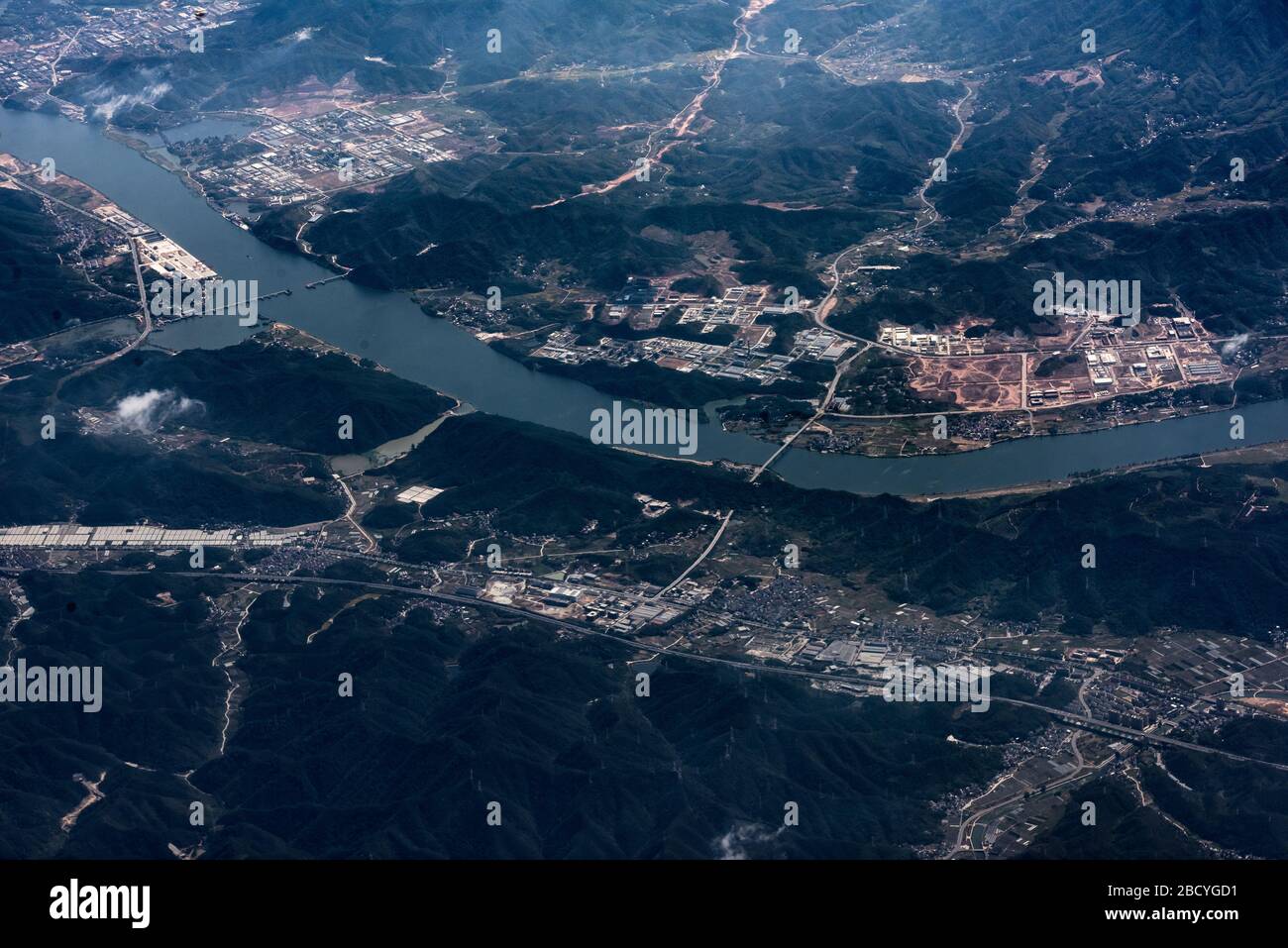 aerial view of town and green mountains Stock Photo - Alamy