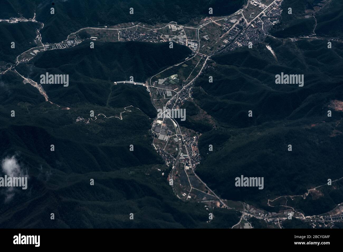 aerial view of town and green mountains Stock Photo - Alamy
