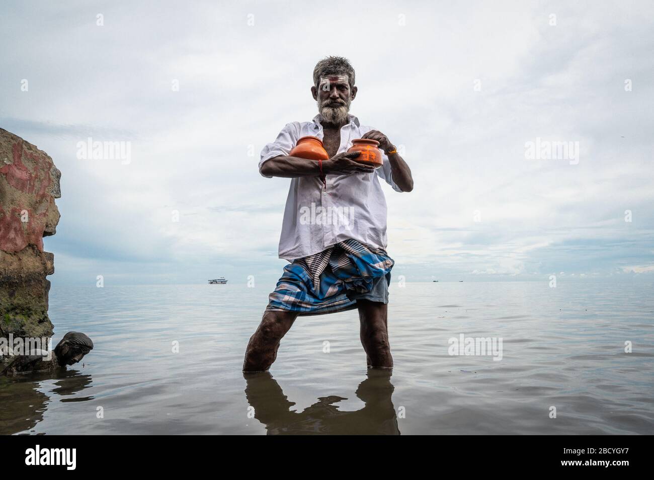 Man in the river, Rameswaram, India Stock Photo