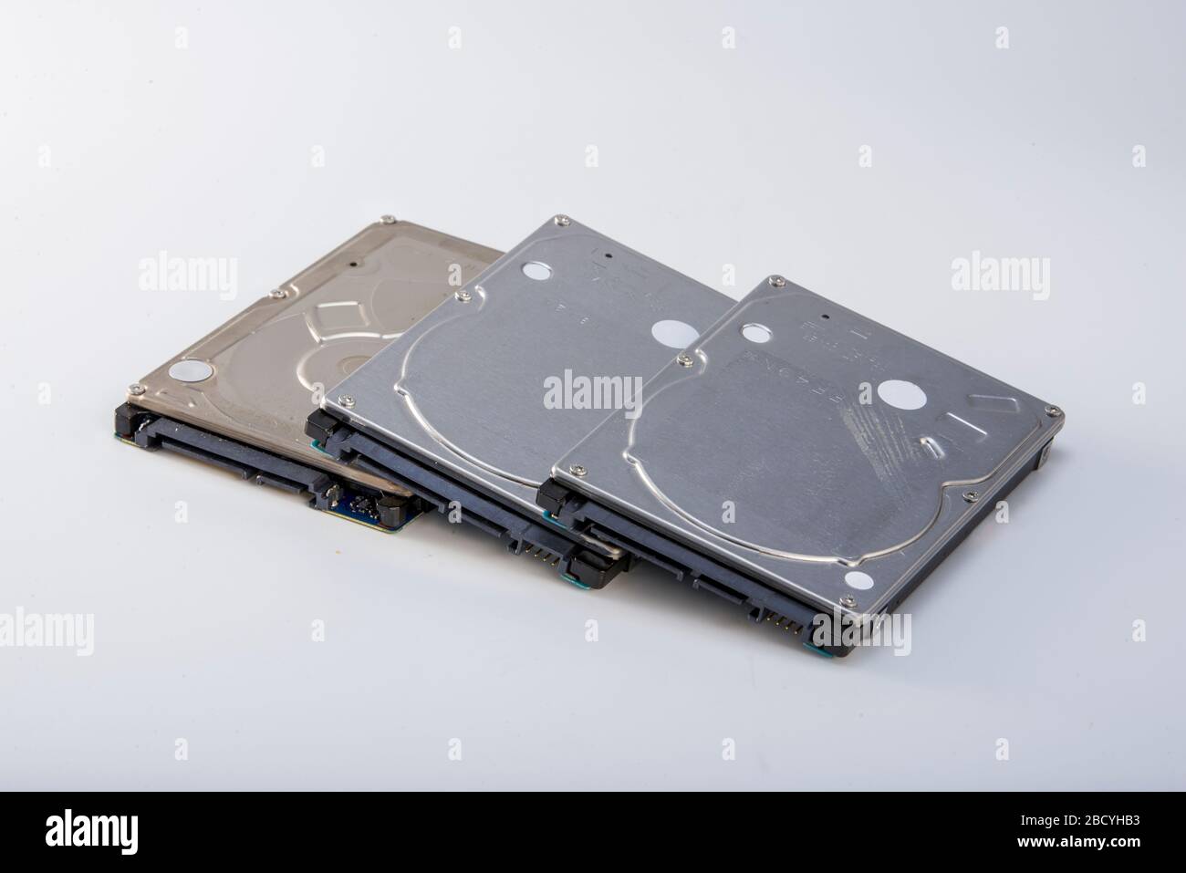 Three 2.5-inch mechanical hard drives close-up Stock Photo