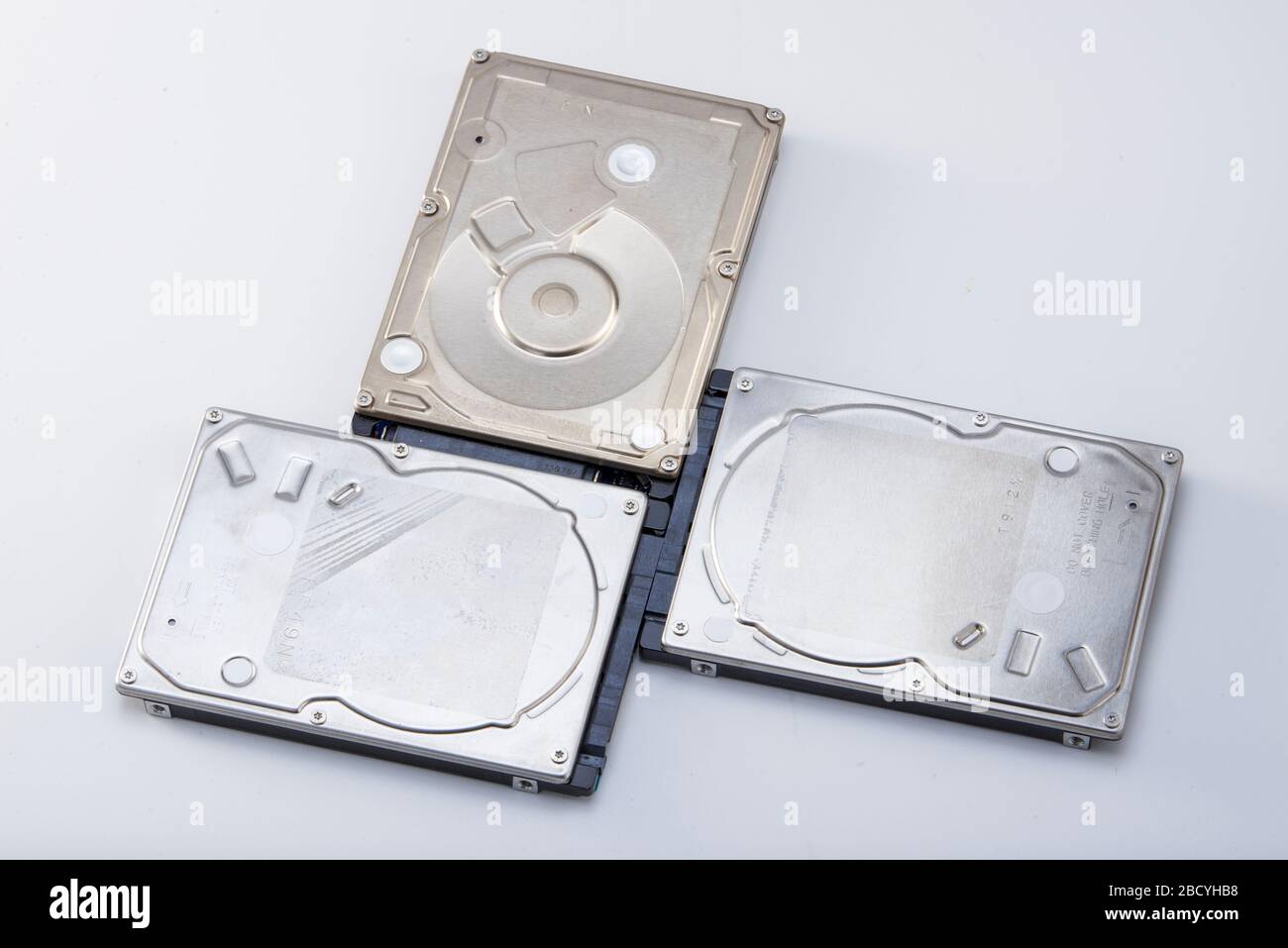 Three 2.5-inch mechanical hard drives close-up Stock Photo