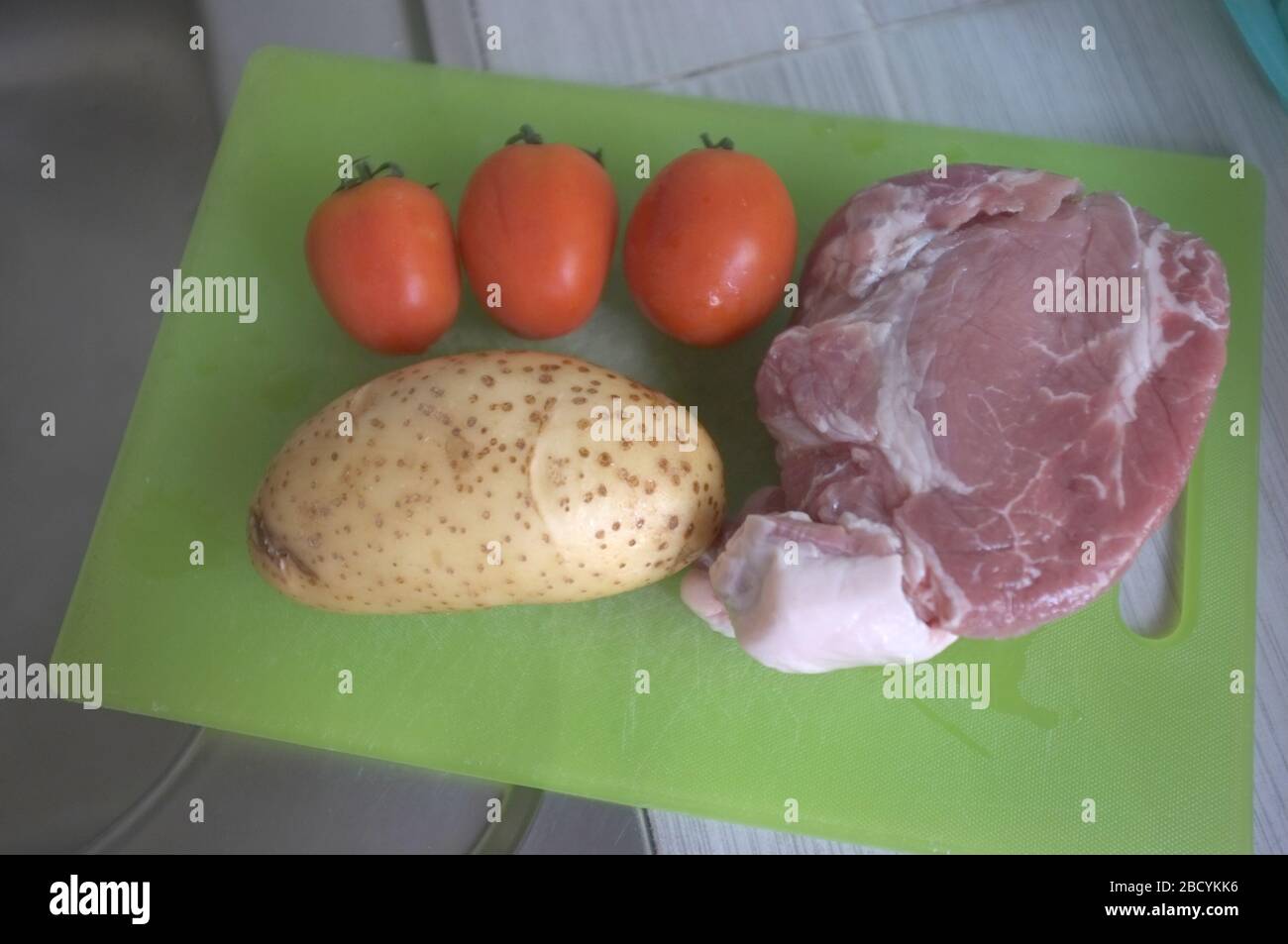 Pork curry ingredients pork meat, tomato , potato Stock Photo Alamy