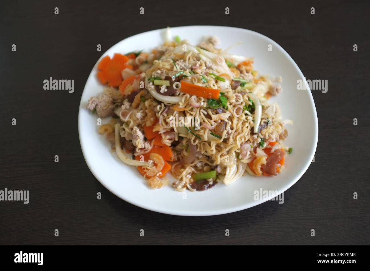 Thai style street food , Instant noodle spicy salad with minced pork and vegetables Stock Photo