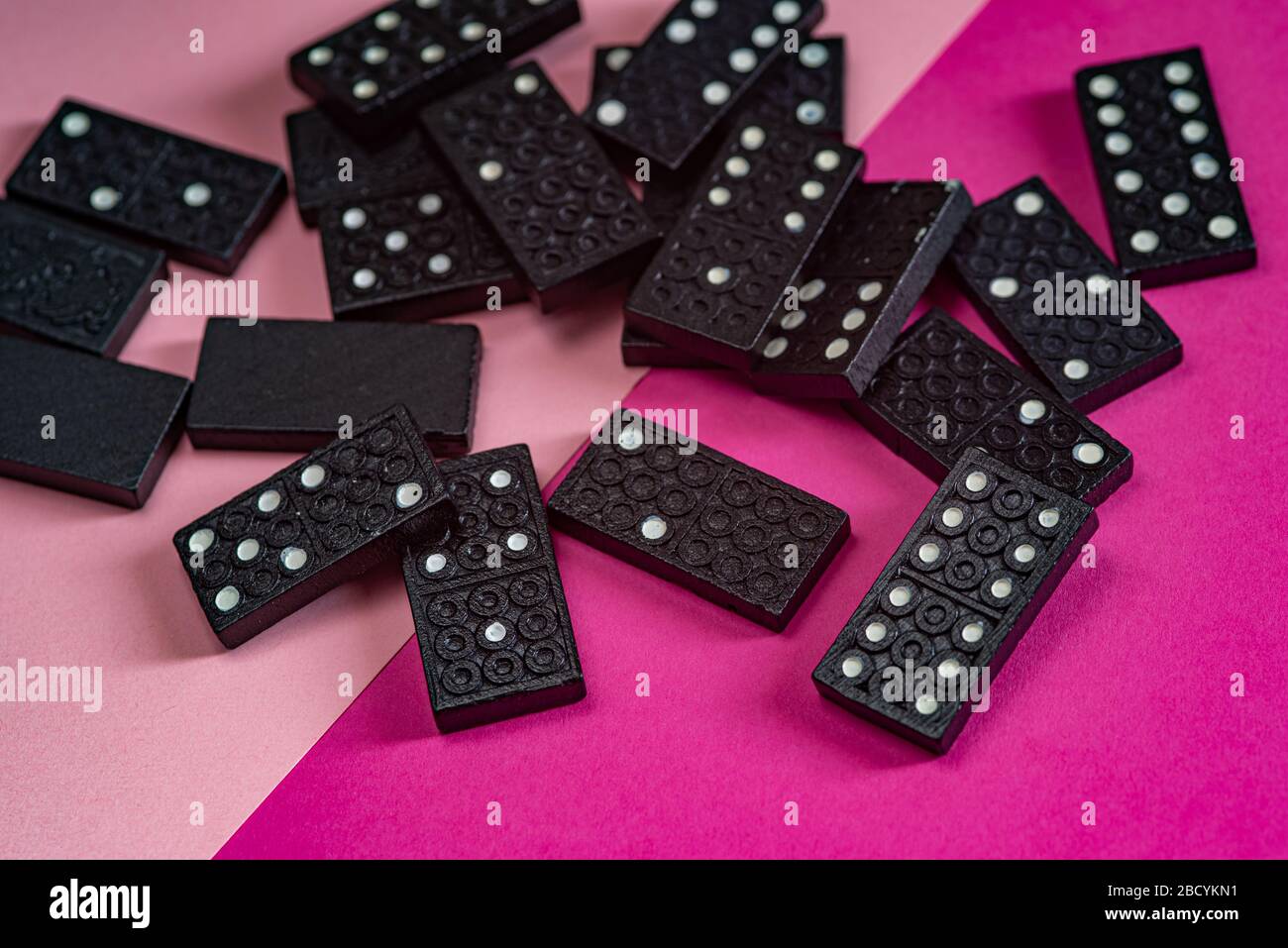 Black Dominoes game block on a colored background Stock Photo - Alamy