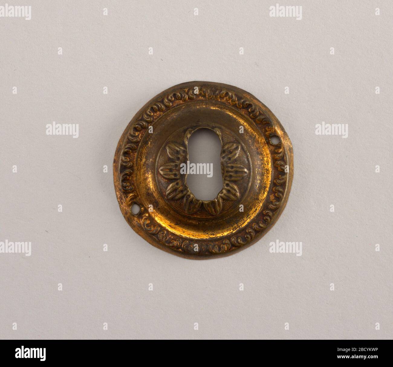 Keyhole escutcheon. Research in ProgressCircular, Raised boss at center