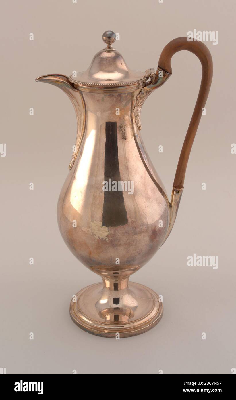 Coffee pot. Research in ProgressTall pear-shaped body on collet foot; hinged domed lid with ball finial; long, flat spout with shallow flutes, joined at bottom with shell mount; long hardwood loop handle joined at bottom with long tubular socket and at top with elaborate acanthus mount; bead Coffee pot Stock Photo