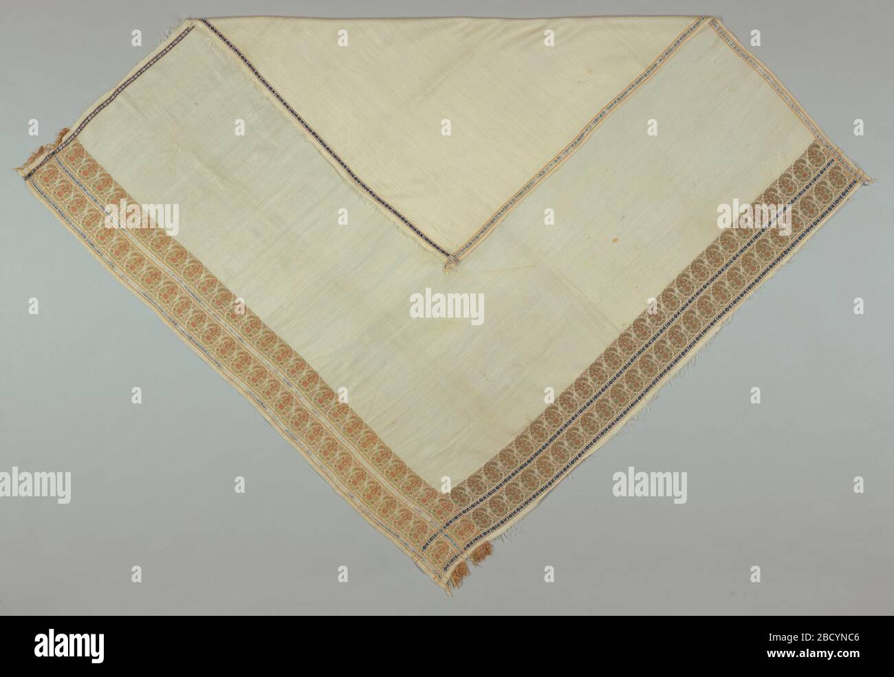 Neckerchief. Research in ProgressCostume accessory with bordered design of paisley botehs along two adjacent right angle edges. Scarf was to be folded diagonally and wrapped over the shoulders. Neckerchief Stock Photo