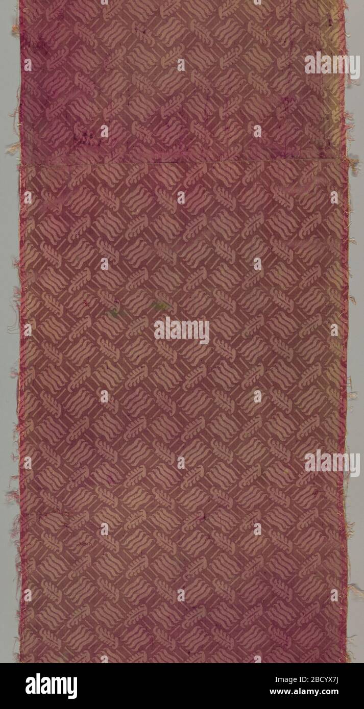 Textile. Research in ProgressVertical panel of mauve damask patterned in a small-scale allover design of a trellis with diamond-shaped intersections that are filled with groups of wavy lines. Marking the intersection of the trellis are small curving stylized leaf forms. Textile Stock Photo