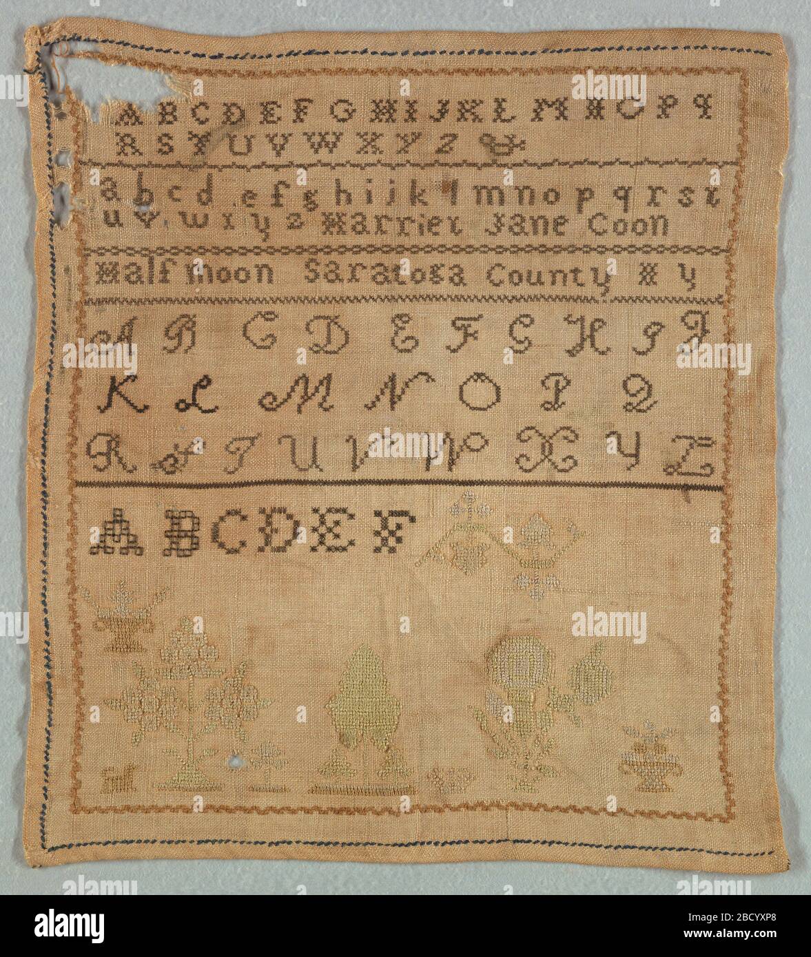 Sampler. Research in ProgressBands of alphabets, the inscription Half Moon Saratoga County NY, and scattered motifs. Sampler Stock Photo