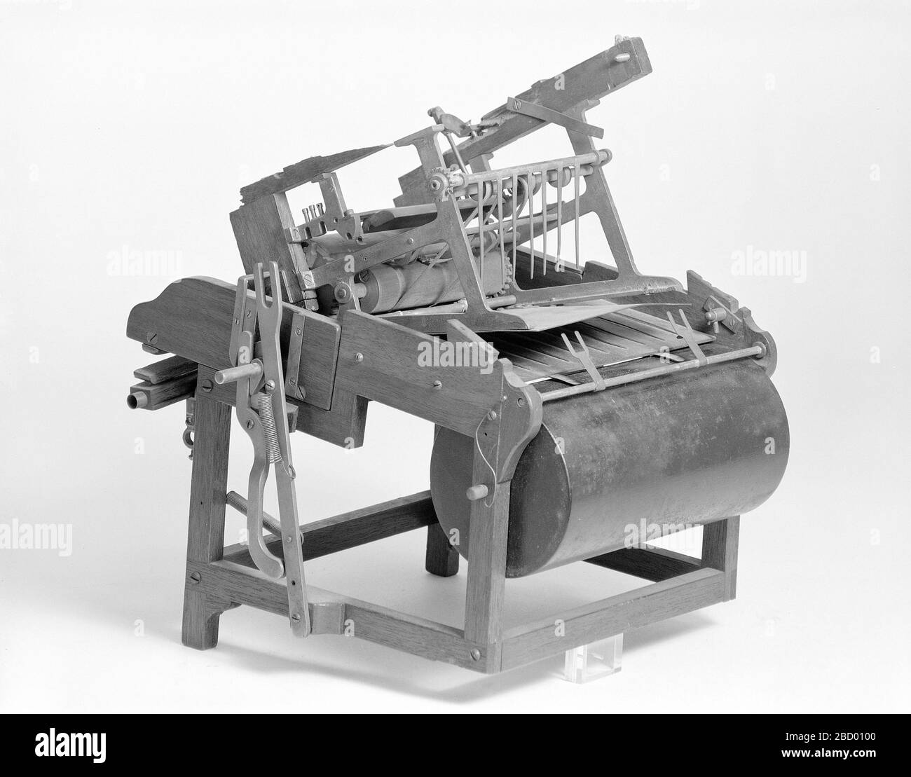 Patent Model of a Sheetfeed Apparatus. This patent model demonstrates an invention for a sheet-feed apparatus which was granted patent number 107851. The patent details a pneumatic feeder for use with presses, calendars and other apparatus. The model is damaged.Currently not on view Patent Model of a Sheetfeed Apparatus Stock Photo