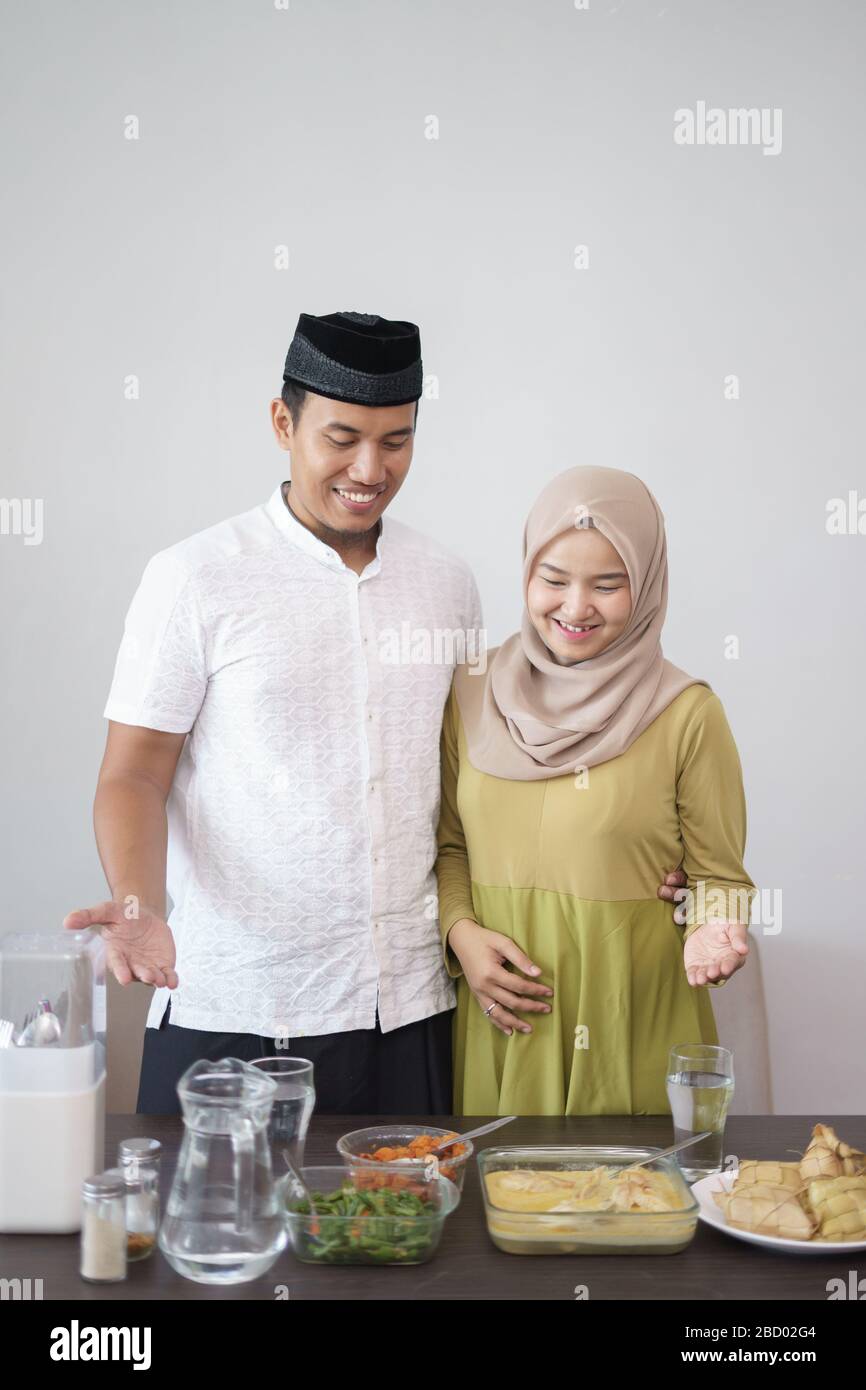 muslim couple presenting their food during ramadan Stock Photo
