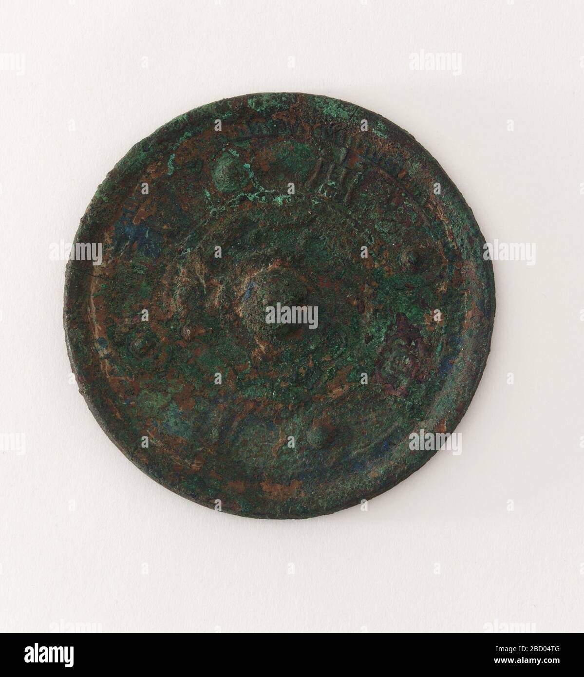; China; 206 B.C.E.-220 C.E.; Bronze; Diam x D: 6.9 x 0.7 cm (2 11/16 x 1/4 in); Gift of Charles Lang Freer Mirror Stock Photo