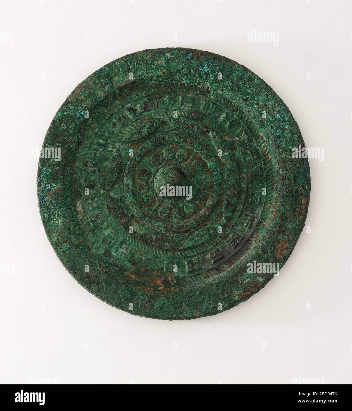 ; China; 206 B.C.E.-9 C.E.; Bronze; Diam x D: 13.3 x 1.2 cm (5 1/4 x 1/2 in); Gift of Charles Lang Freer Mirror Stock Photo