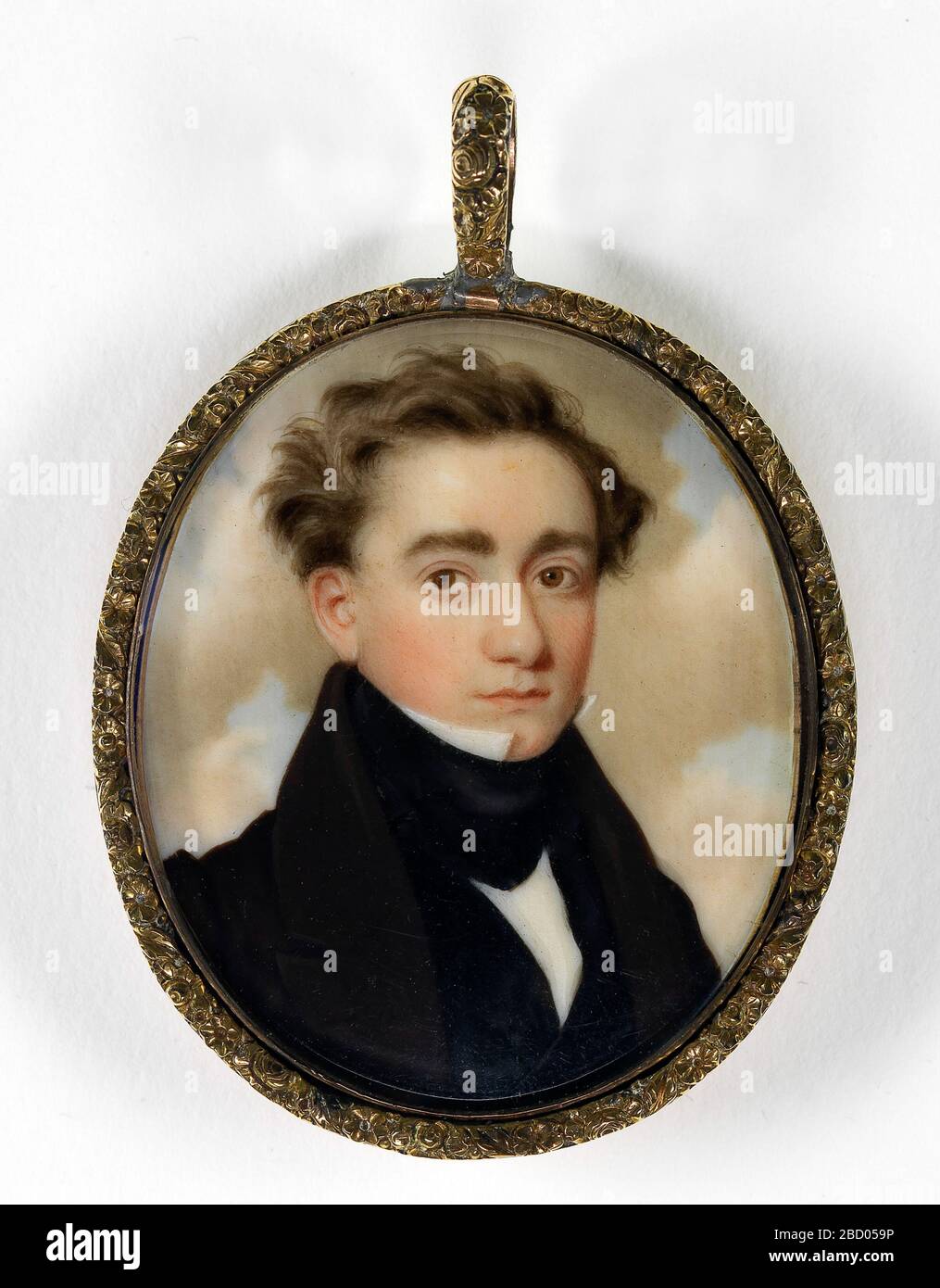 Portrait of a Gentleman. This miniature was painted while John Wood Dodge was living in New York. The unknown gentleman wears what appears to be a tailcoat, with a fashionably high collar and gilt buttons. Stock Photo