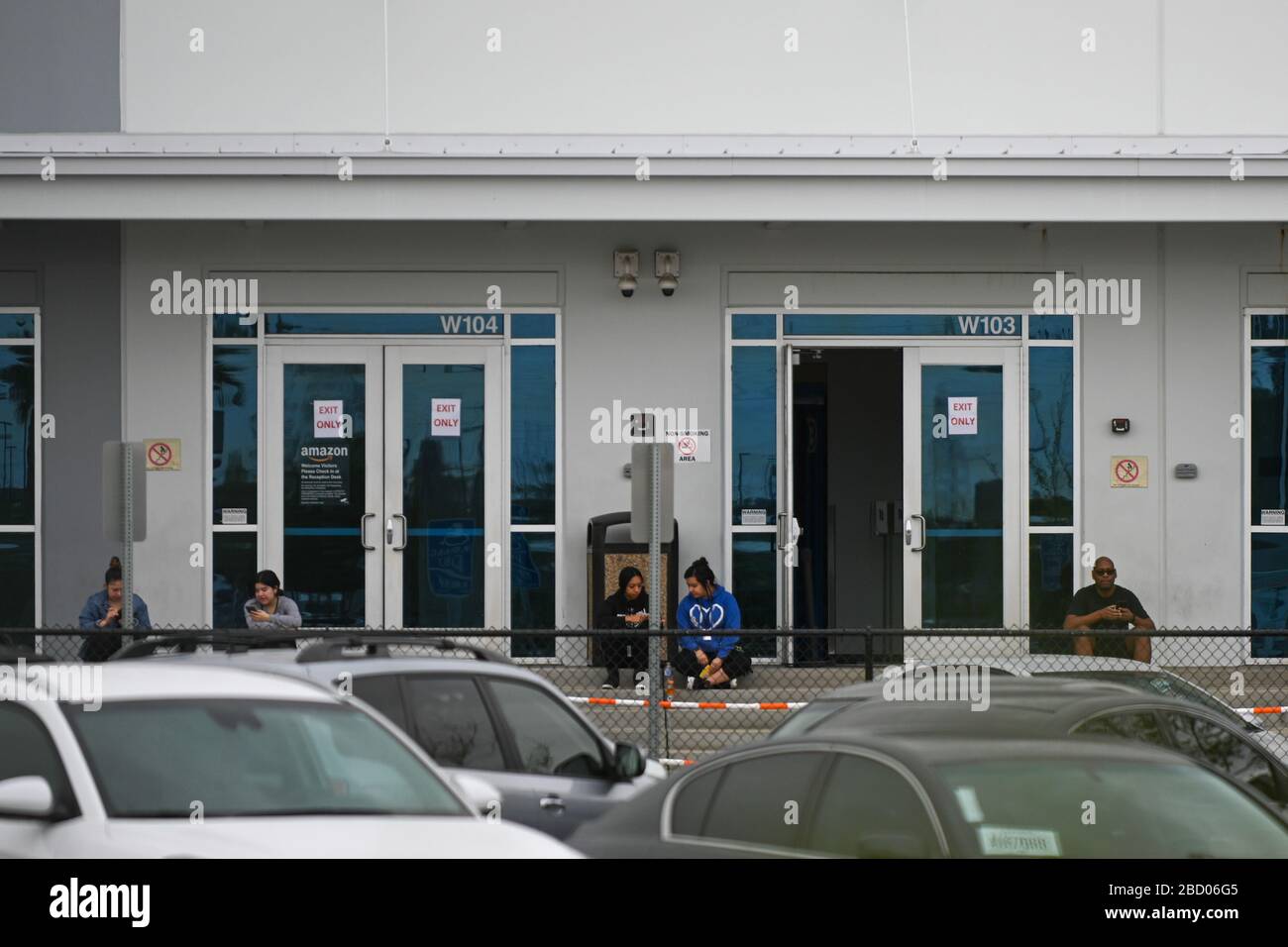 Amazon works sit outside an Amazon Fulfillment Center (LGB3), Saturday