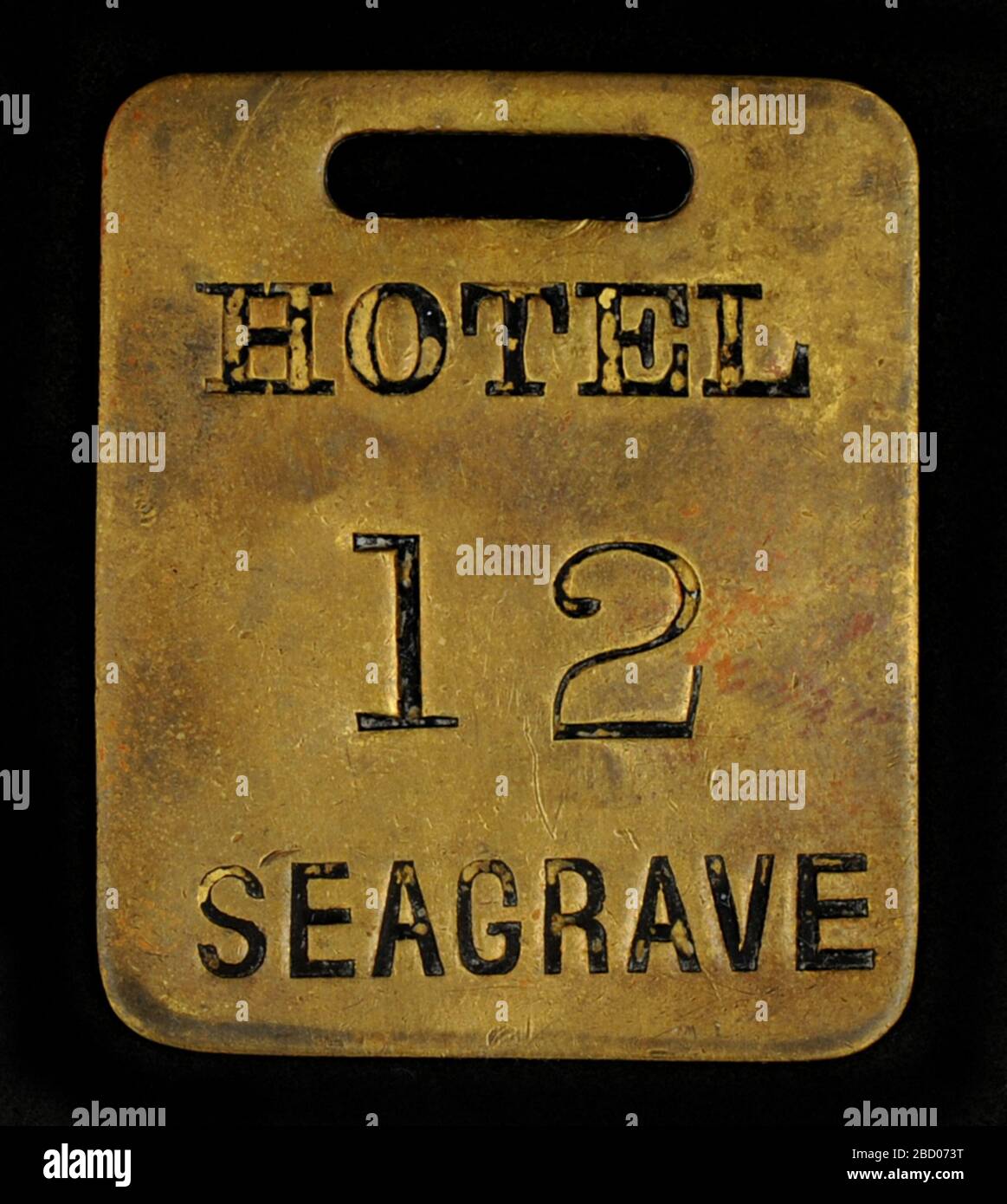 Hotel Seagrave Owney tag. Owney probably received this hotel key check token from Arthur A. Seagrave or one of his employees. Sometime in 1889-1890, Seagrave built a hotel on the corner of Virginia and 3rd Avenue in Seattle, Washington, naming it after himself. Hotel Seagrave Owney tag Stock Photo
