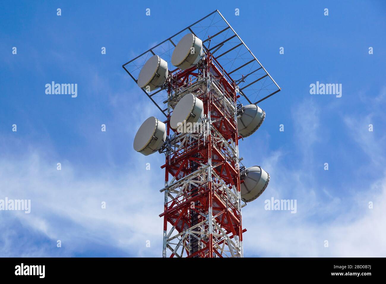 Telecommunication tower with a sunlight. Used to transmit television signals. Stock Photo