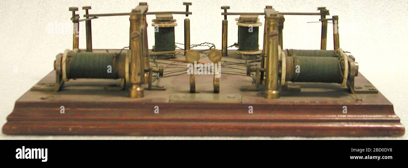 Clark telegraph repeater patent model. Telegraph repeaters amplified electrical signals in a telegraph line. Telegraph messages traveled as a series of electrical pulses through a wire from a transmitter to a receiver. Short pulses made a dot, slightly longer pulses a dash. NMAH2002-27288 Stock Photo