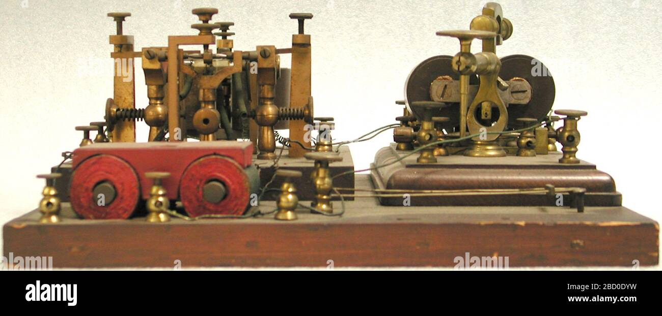 WilliamsFarmer duplex telegraph patent model. Telegraph relays amplified electrical signals in a telegraph line. Telegraph messages traveled as a series of electrical pulses through a wire from a transmitter to a receiver. Short pulses made a dot, slightly longer pulses a dash. NMAH2002-11475 Stock Photo
