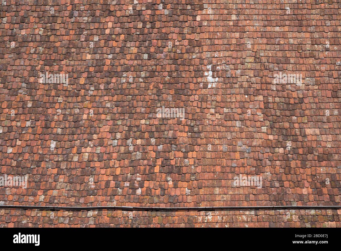 Large roof with very old roof tiles Stock Photo