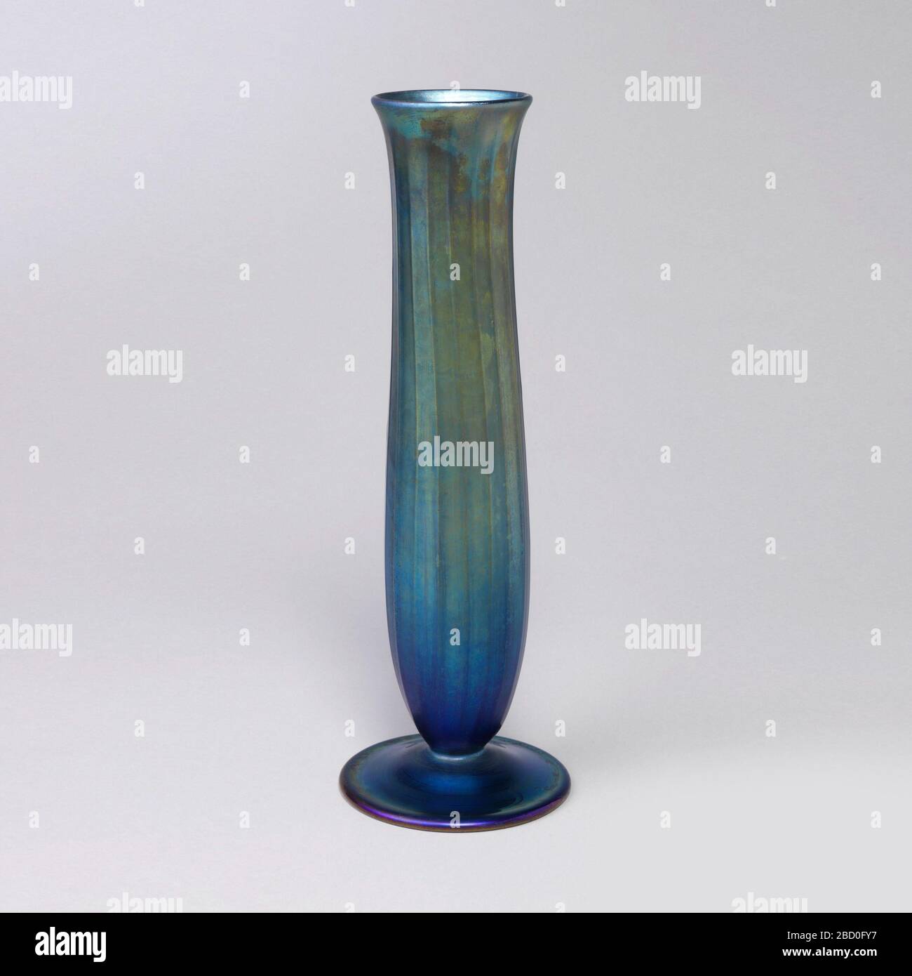 Vase. Research in ProgressLong tall cylindrical and footed vase in iridescent purple to green