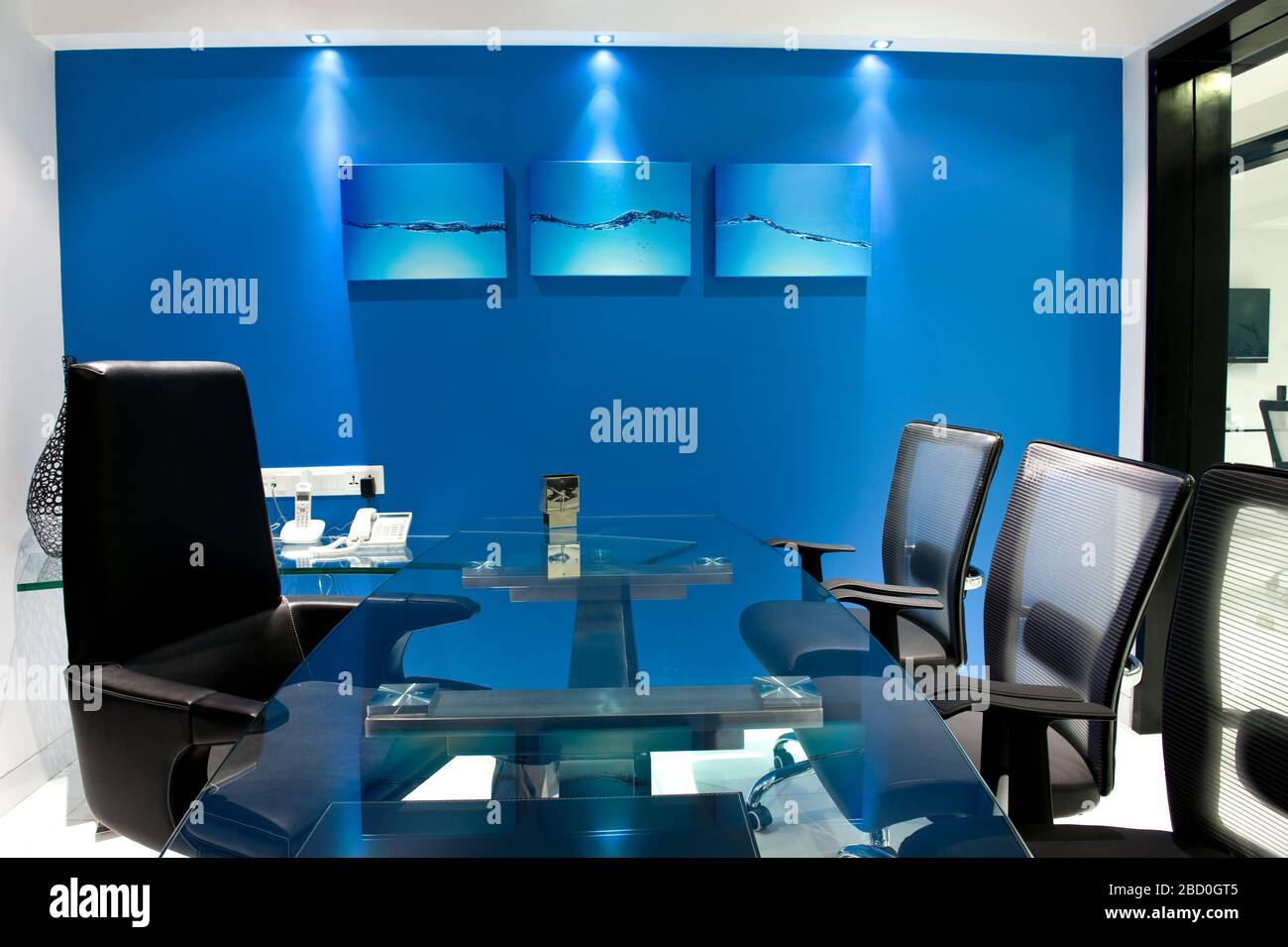 Modern manager office interior with a Blue walls, a stylish table