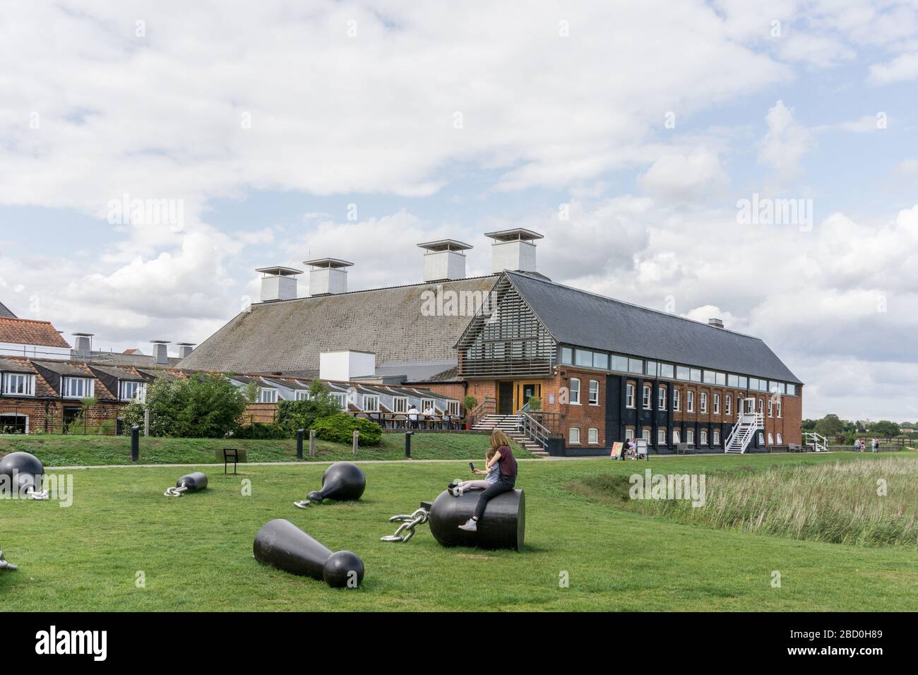 The concert hall at Snape Maltings, Suffolk, UK; modern art installation in the foreground Stock Photo