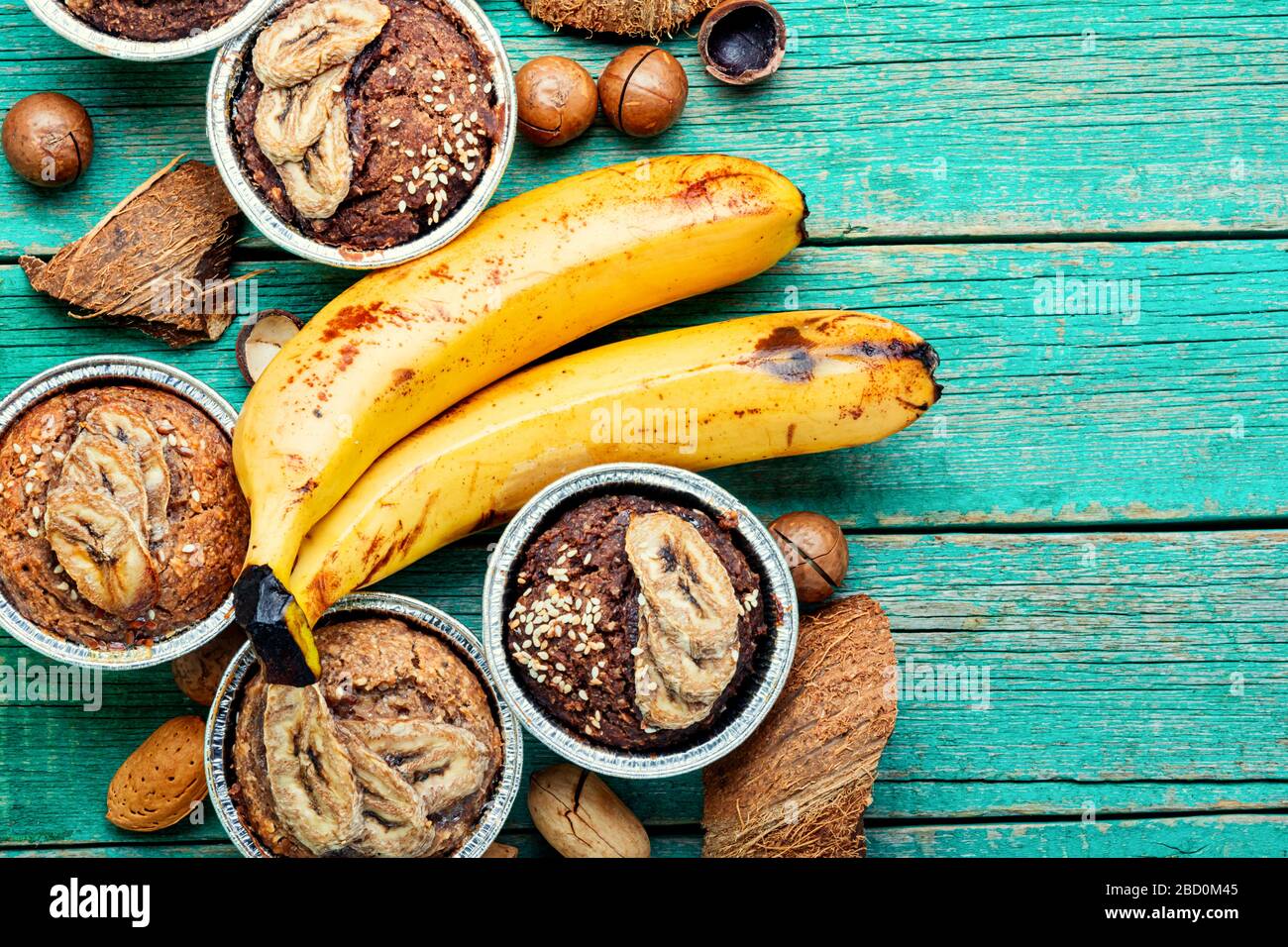 Muffins with banana, mix nuts and coconut.Copy space Stock Photo - Alamy